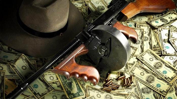 Thompson submachine gun on money and hat