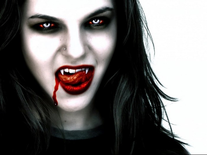 Vampire with fangs and blood
