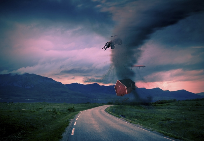 Tornado destroying a farm with a tractor and house