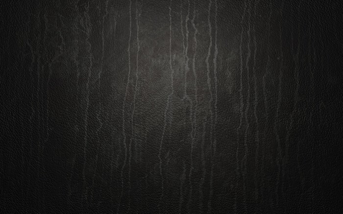 Dark textured surface with vertical streaks
