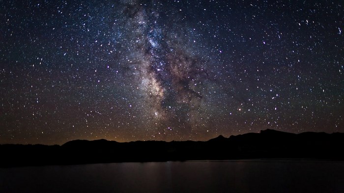 Milky Way over mountains and lake