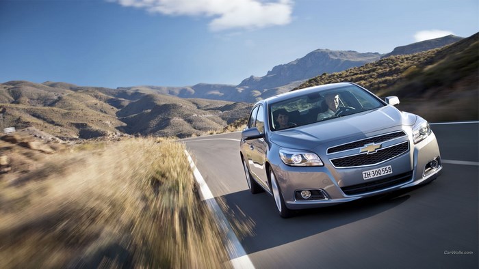 Chevrolet Malibu driving on a mountain road