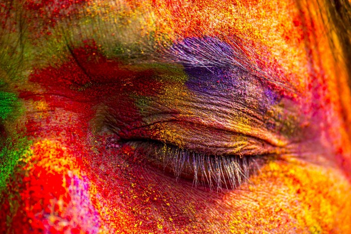 Close-up of a face covered in Holi powder