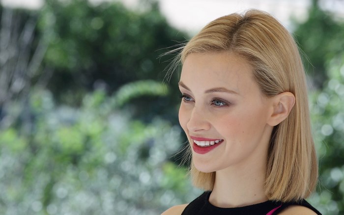 Sarah Gadon smiling outdoors