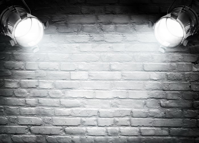 Spotlights on a brick wall