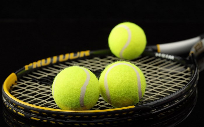 Tennis racket with three tennis balls