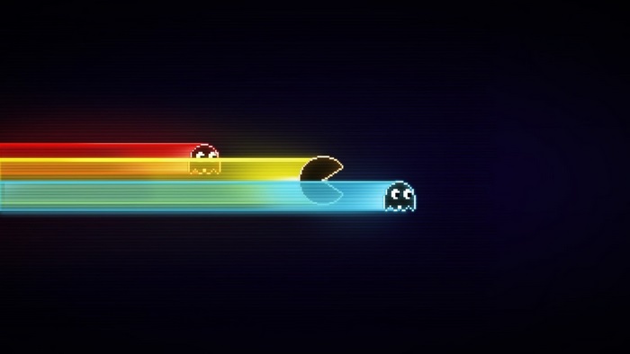 Pac-Man and ghosts with colorful light trails