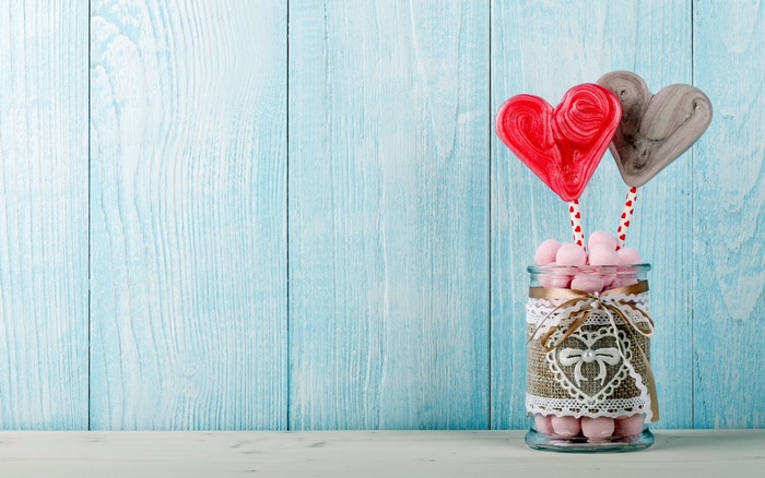 Heart-shaped lollipops in a jar with marshmallows