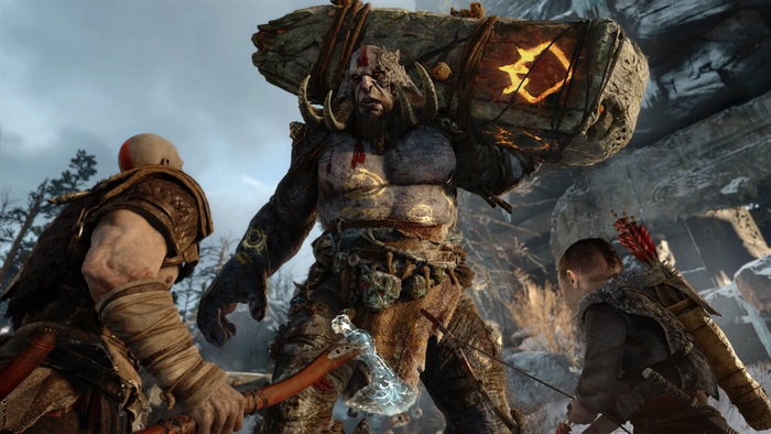 Kratos and Atreus fight a troll in God of War