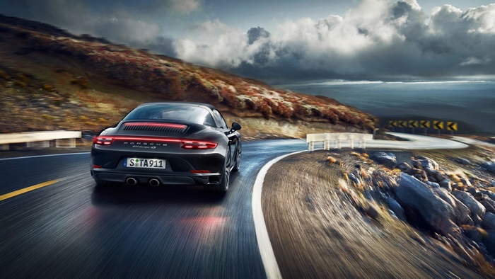 Porsche 911 Targa 4S driving on mountain road