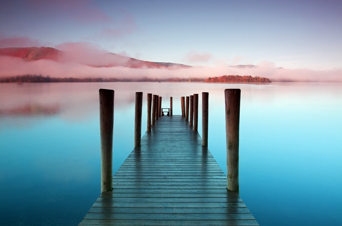 Wooden pier on a lake at sunrise