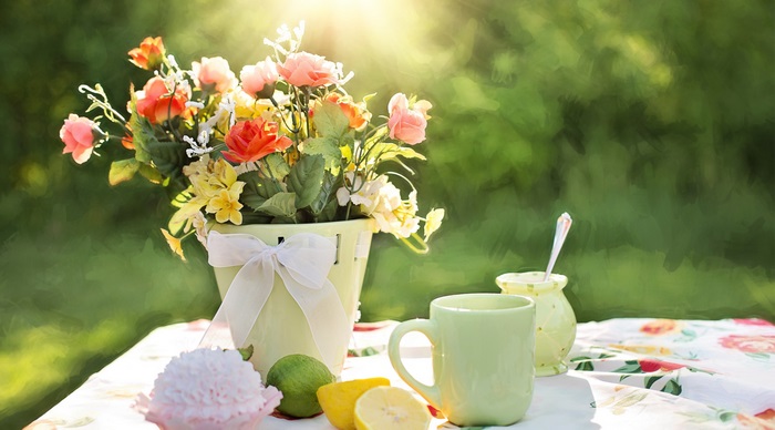 Spring flowers and tea set on a table
