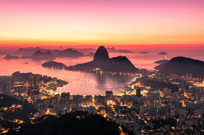 Rio de Janeiro cityscape at sunset with Sugarloaf Mountain