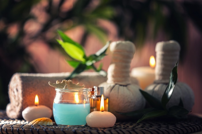 Spa setting with candles and massage balls