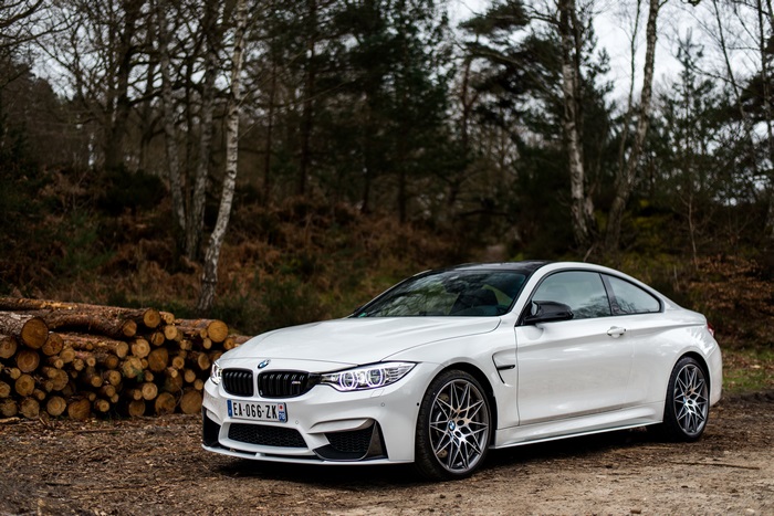 White BMW M4 Coupe in Forest