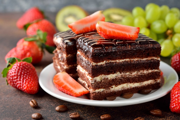 Chocolate cake with strawberries and coffee beans