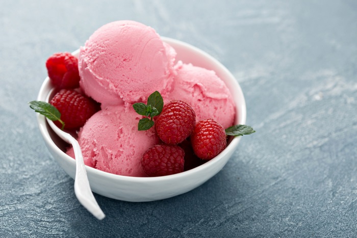 Pink ice cream with raspberries and mint