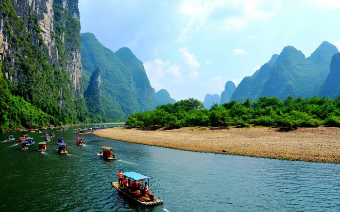 Scenic Li River with Traditional Boats and Green Mountains