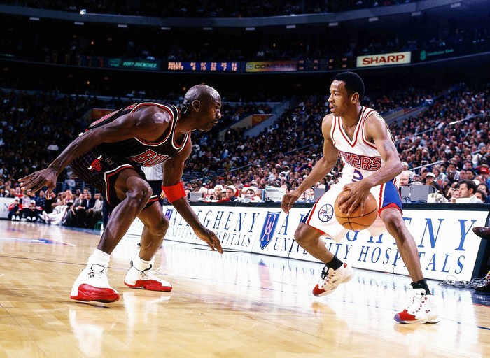 Michael Jordan and Allen Iverson playing basketball