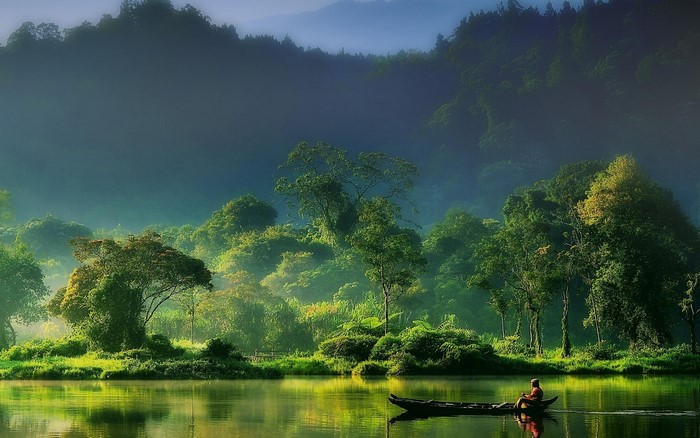 Serene Morning on Indonesian River with Fisherman