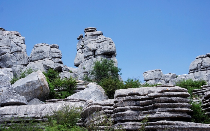 Karst landscape with rock formations and blue sky
