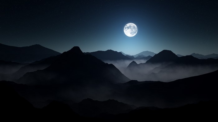 Mountain range under a full moon and starry night sky