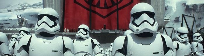 First Order Stormtroopers in front of a large banner