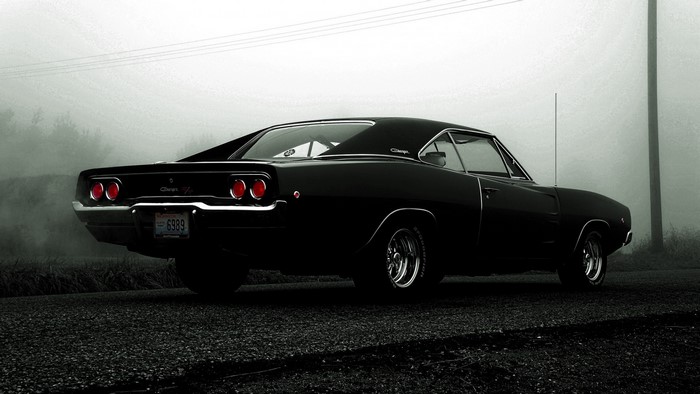 Black 1968 Dodge Charger R/T on a foggy road