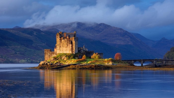 Eilean Donan Castle by Serene Lake in Scotland