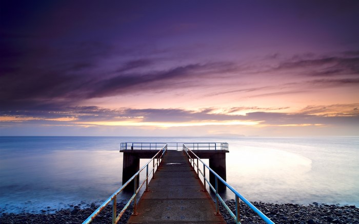 Pier over the sea at sunset