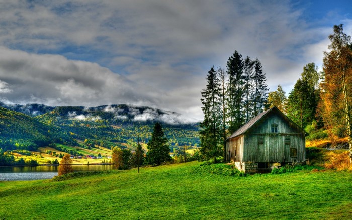 Peaceful Lakeside Hut in Autumn Landscape