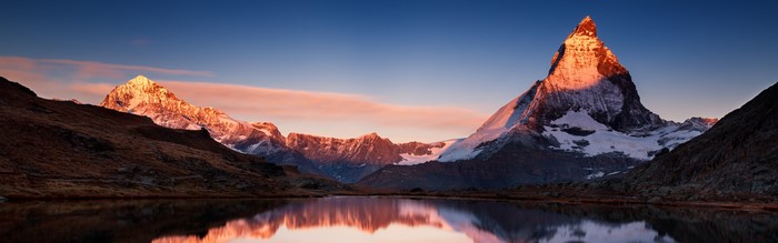 Matterhorn mountain at sunset reflected in lake
