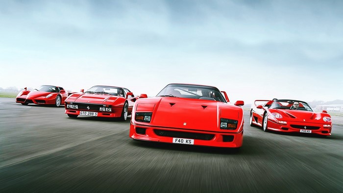 Ferrari 288 GTO, F40, F50, and Enzo on a track