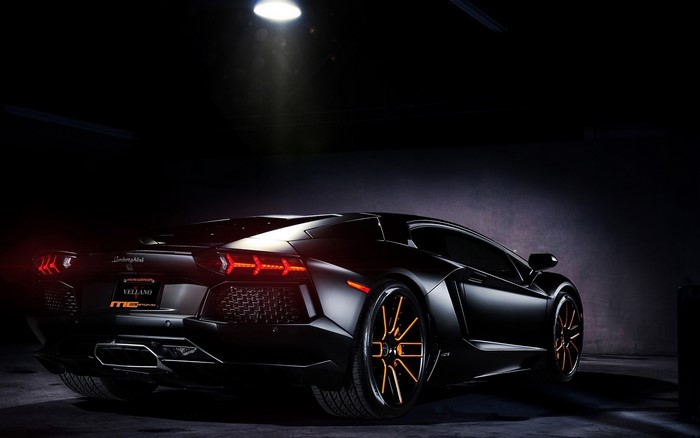 Black Lamborghini Aventador with orange rims