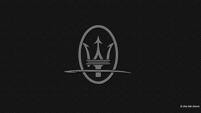 Maserati logo on carbon fiber texture