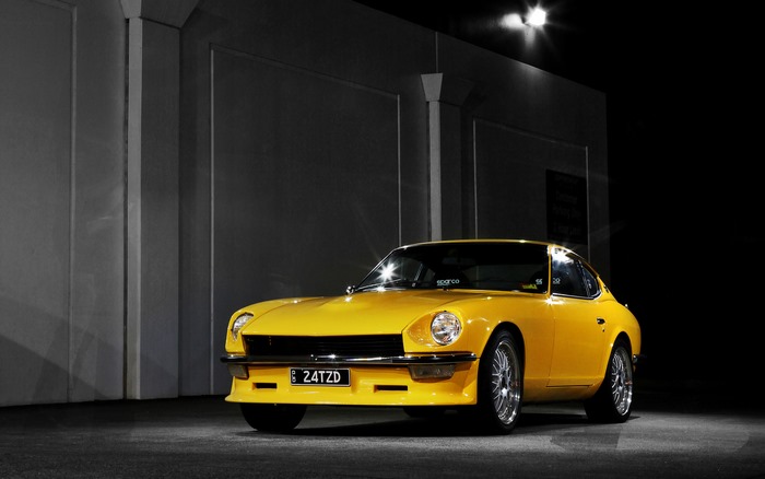 Yellow Datsun 240Z car at night