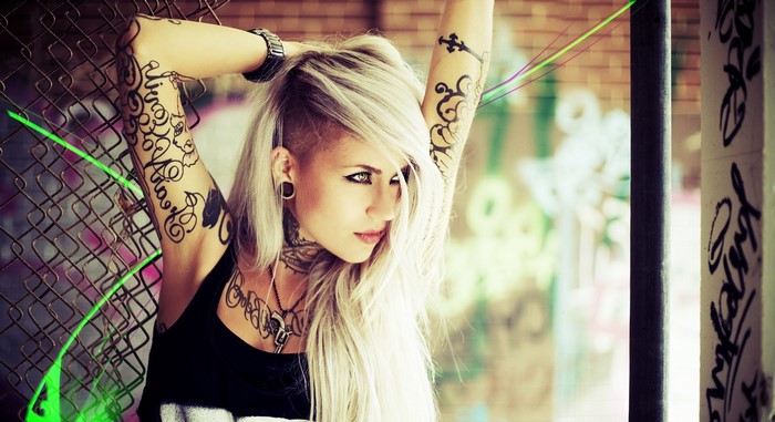 Woman with tattoos and piercings