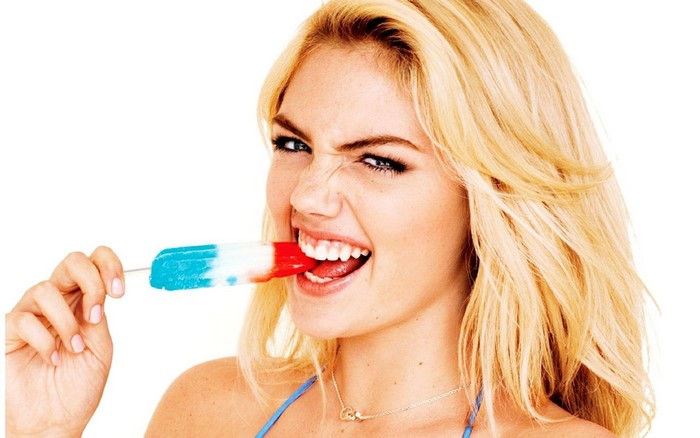 Kate Upton eating a red, white, and blue popsicle