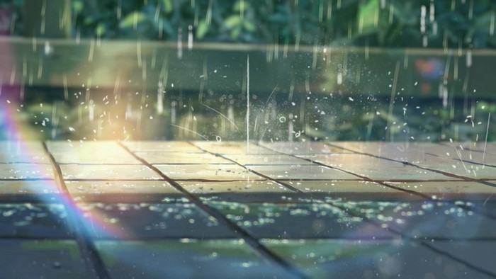Rain on Pavement with Sunlight and Rainbow