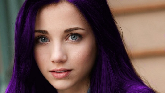 Woman with purple hair and blue eyes