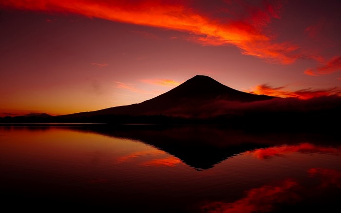 Mount Fuji volcano at sunset with lake reflections