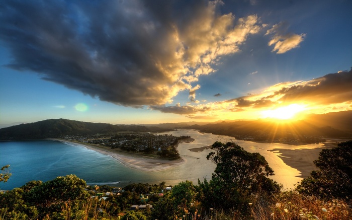 Sunset over a coastal town and bay