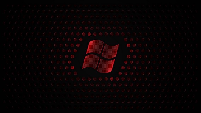 Windows 7 logo on a red and black dotted background