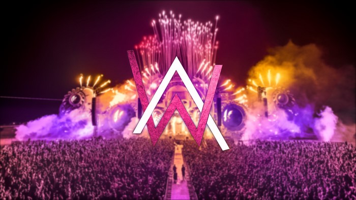 Alan Walker logo at a concert with fireworks