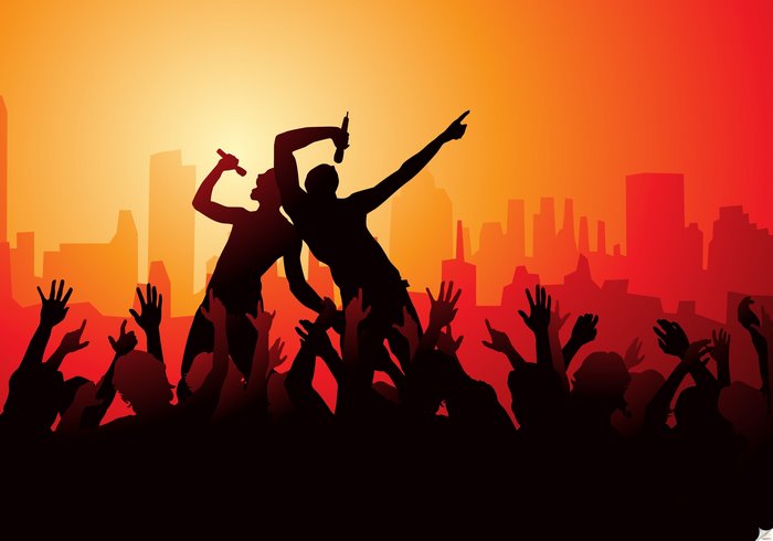 Singers performing in front of a city skyline at sunset