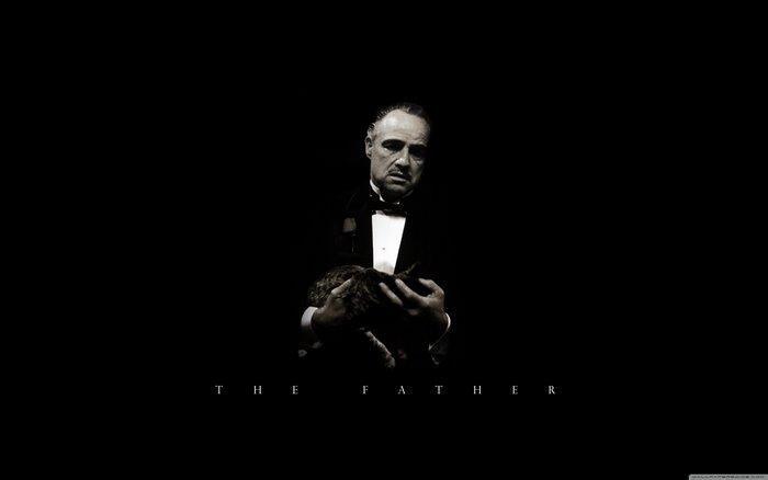 Vito Corleone from The Godfather holding a cat