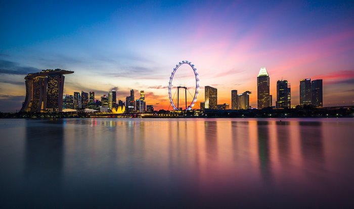 Singapore skyline with Ferris wheel at sunset