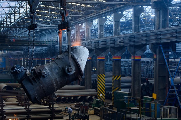Molten metal being poured in a factory
