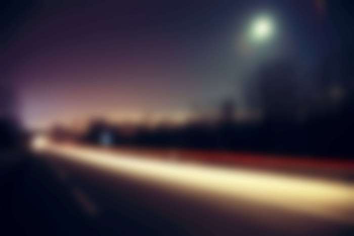 Blurred highway at night with light trails 4K