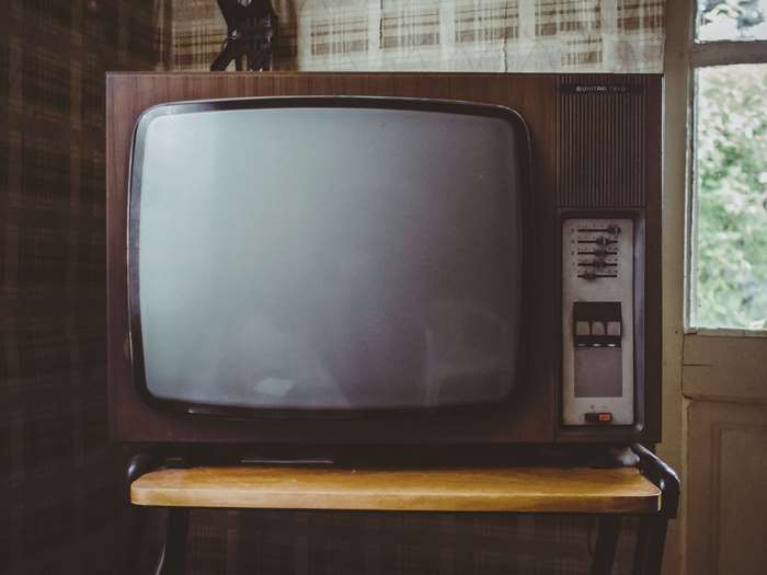 Vintage CRT television with wooden casing